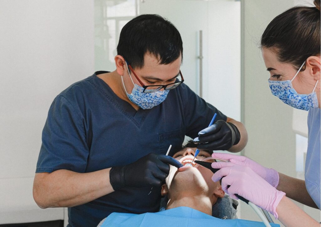 Patient undergoing a dental implant evaluation and treatment planning appointment, discussing factors that can affect the cost of dental implants.