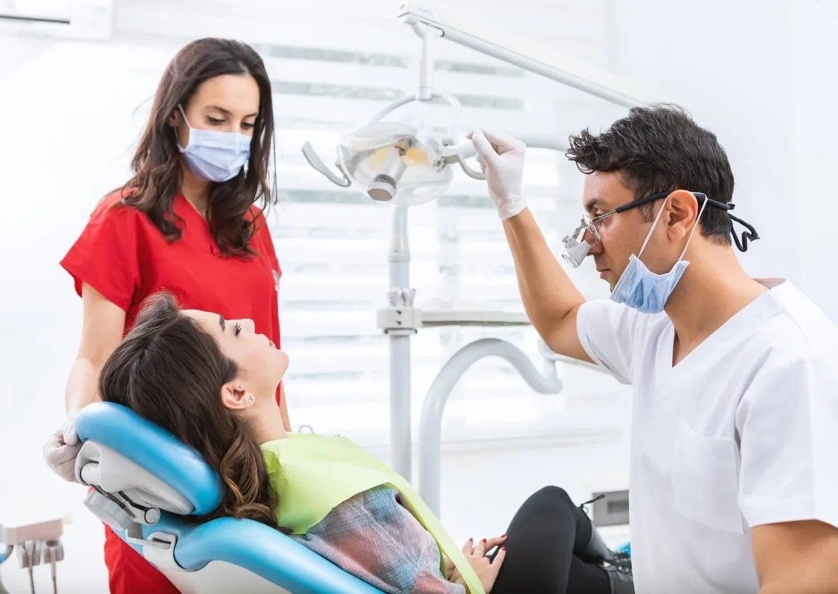 Dentist consulting with a patient for a dental bone graft procedure to restore lost jawbone.
