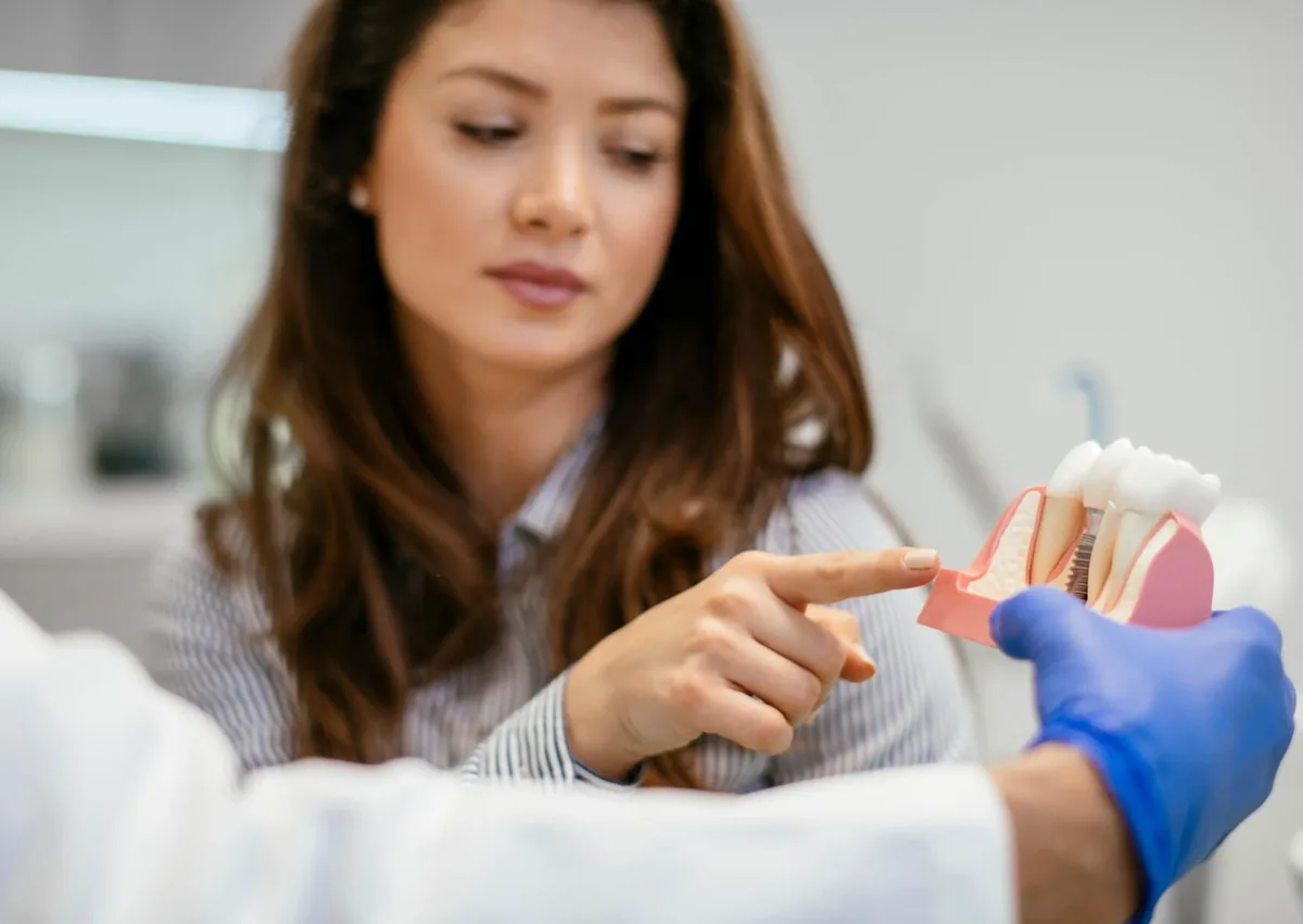 Patient discussing dietary restrictions and avoiding dairy after dental implant surgery.